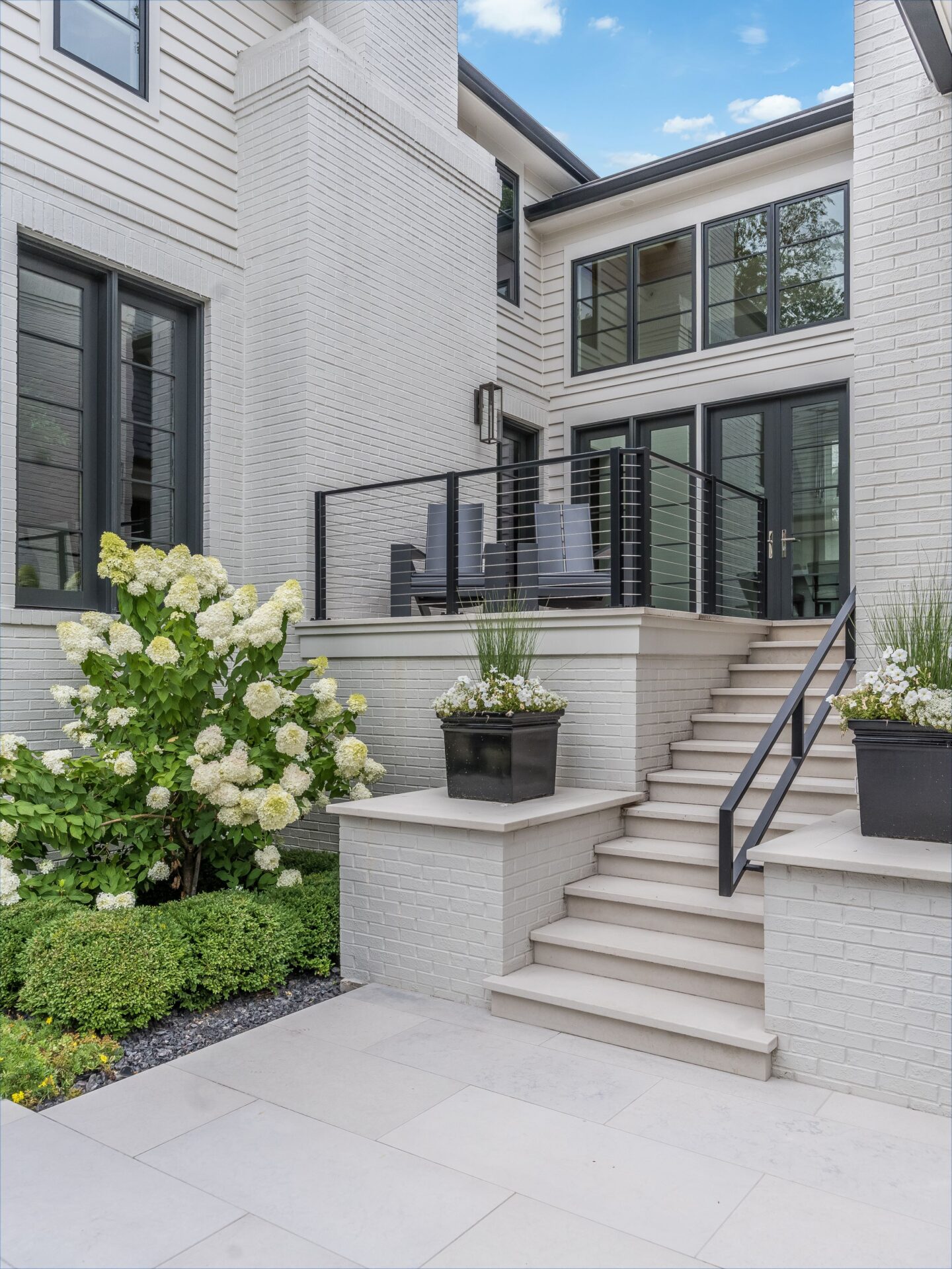 Travertine vs. Concrete Pavers in Canton, GA — What the Material Choice Actually Changes Over 10 Years
