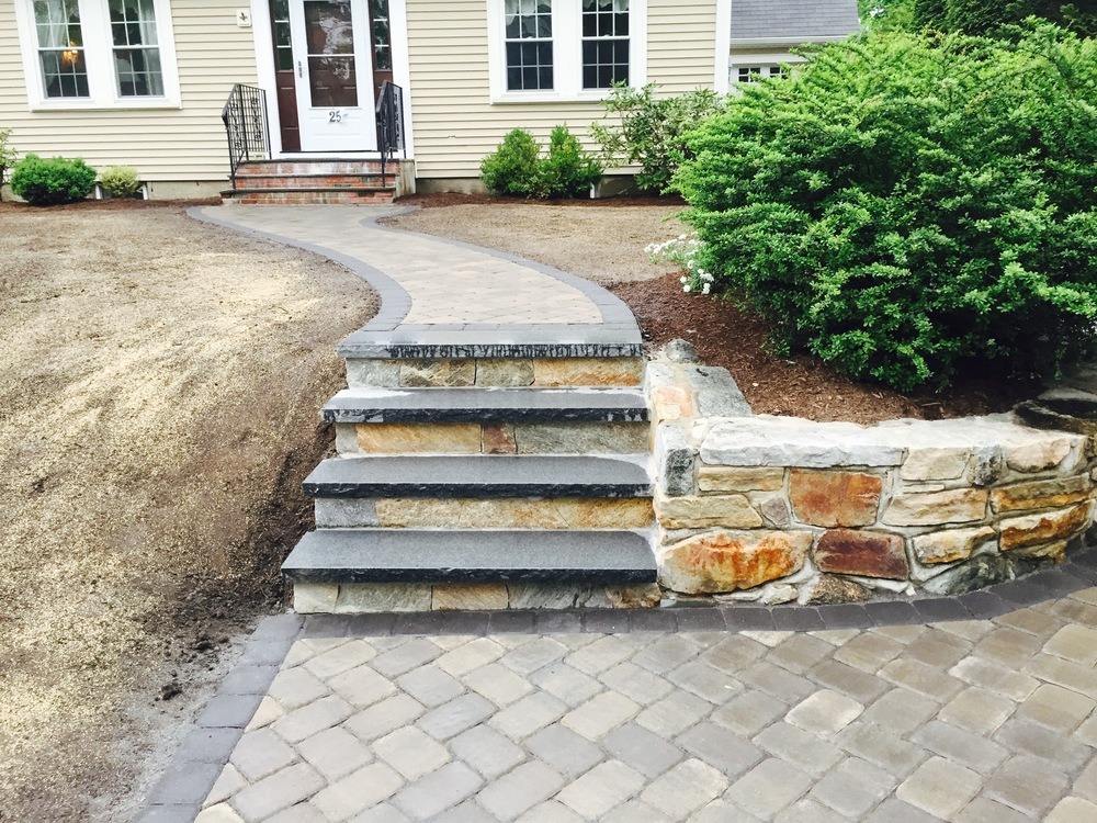 Custom outdoor staircase completed in Alpharetta Georgia by Kaizen Scapes — finished installation with lighting and premium stone