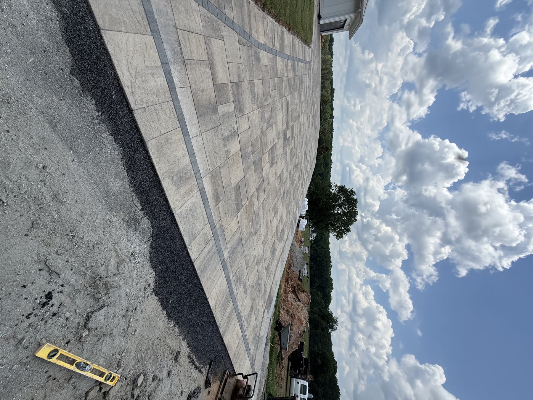 Large paver field installation North Georgia — soldier course border and screeded base by Kaizen Scapes