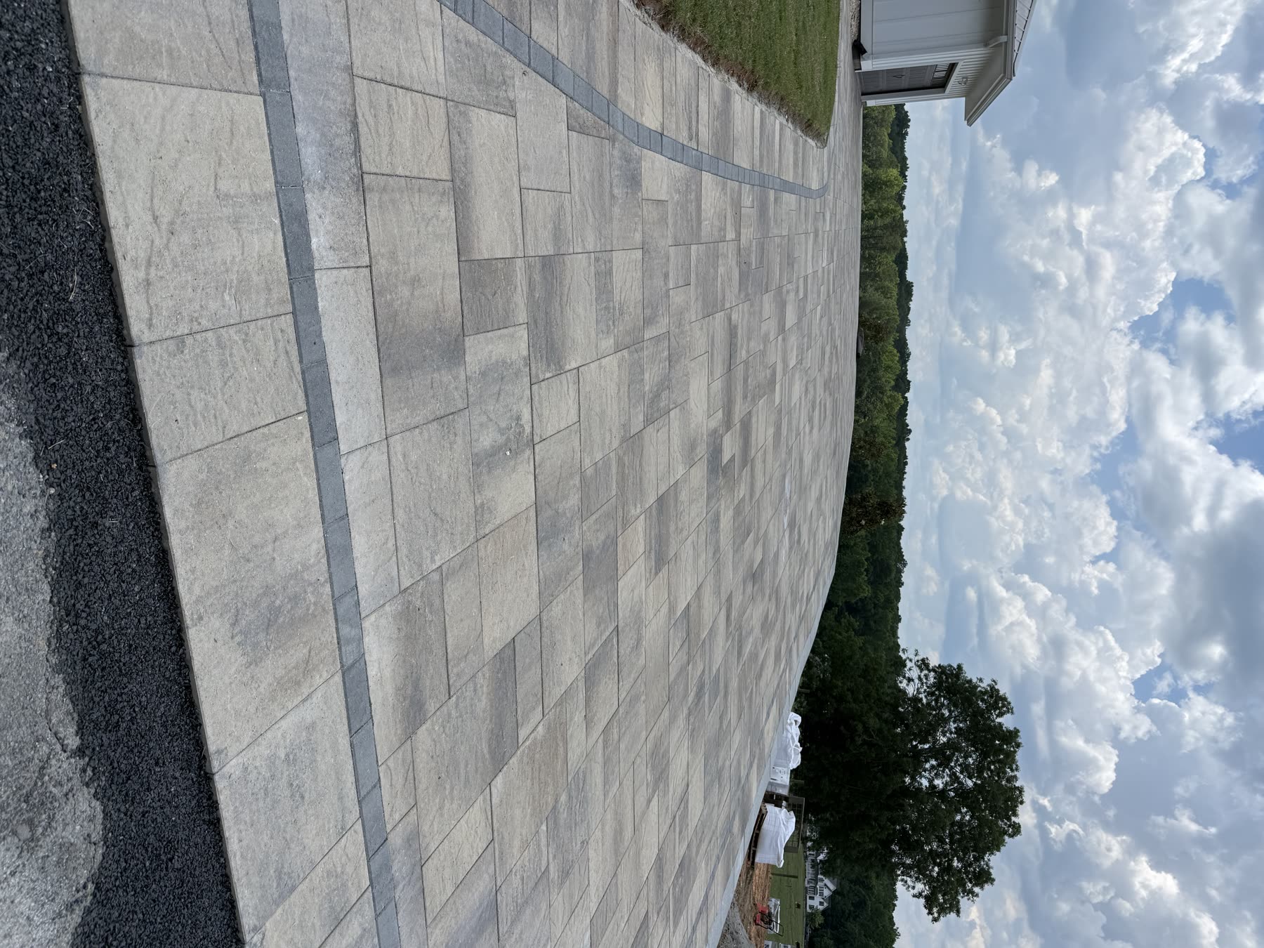 Paver hardscape field with contrasting soldier course border North Georgia — installed by Kaizen Scapes